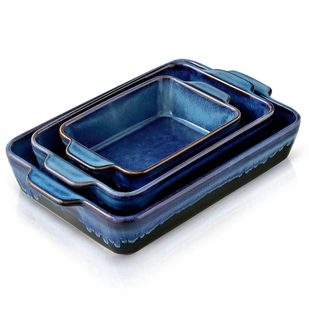 Set of three blue ceramic dishes on a white background