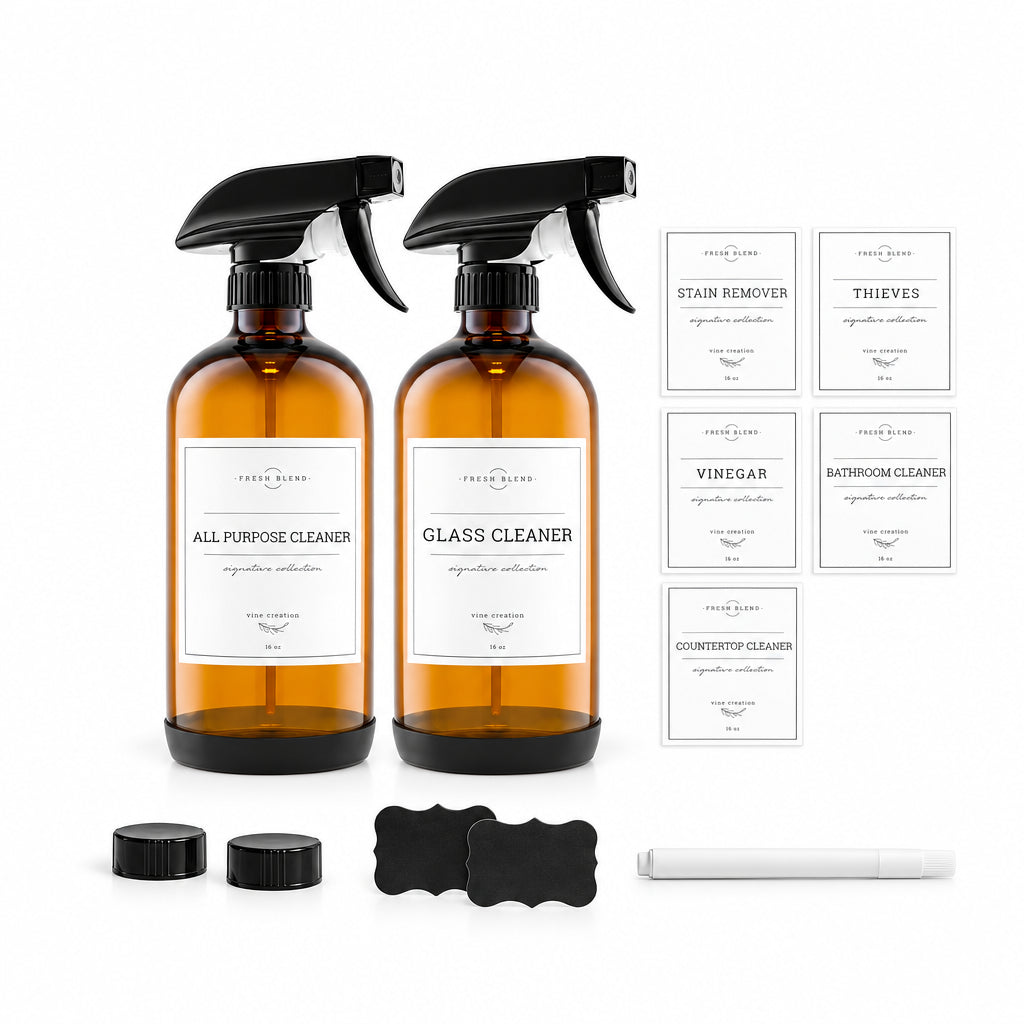 Two amber glass清洁器 bottles with black sprayers and labels on a white background.