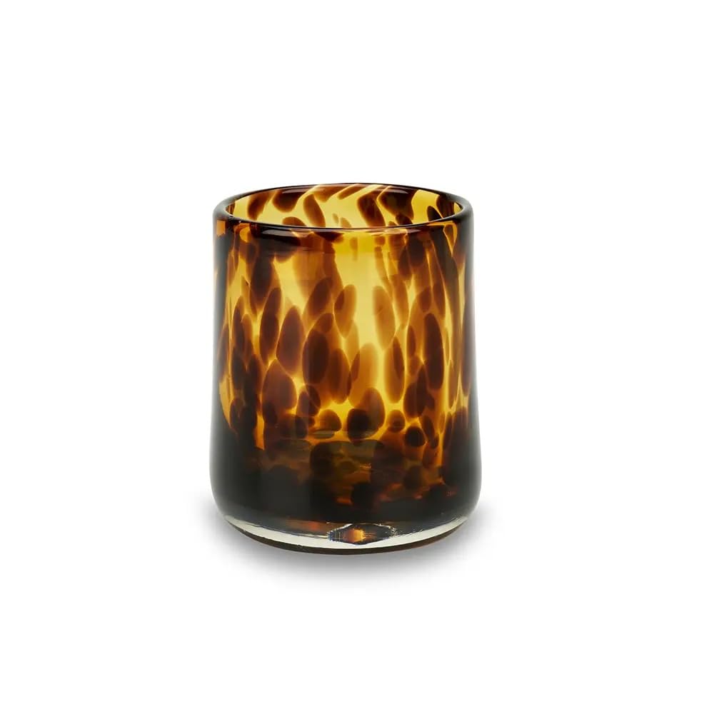 Tortoiseshell patterned glass candle holder on a white background