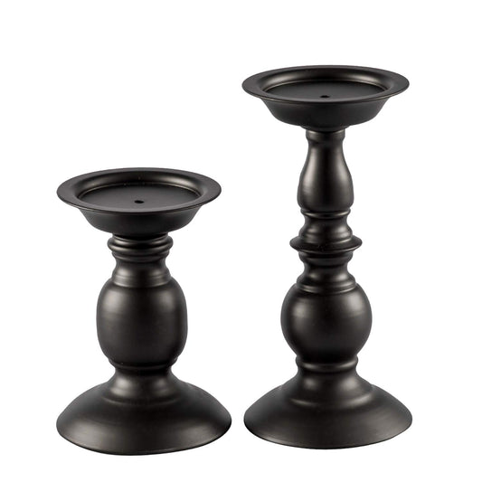 Two black candle holders on a white background