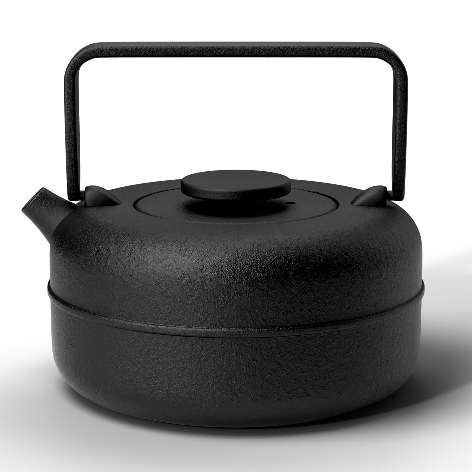 Black cast iron kettle on a white background